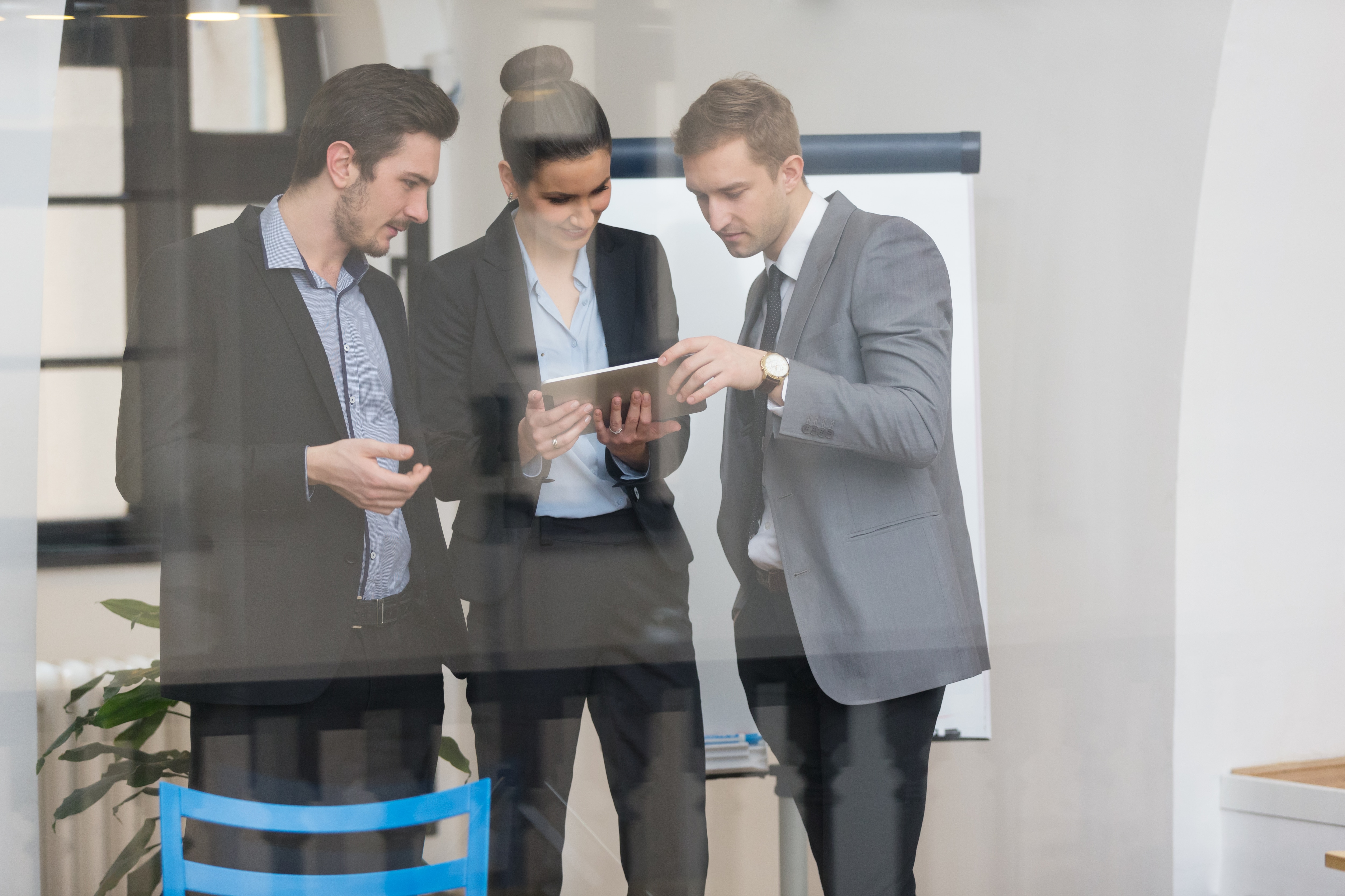 Three people in office meeting