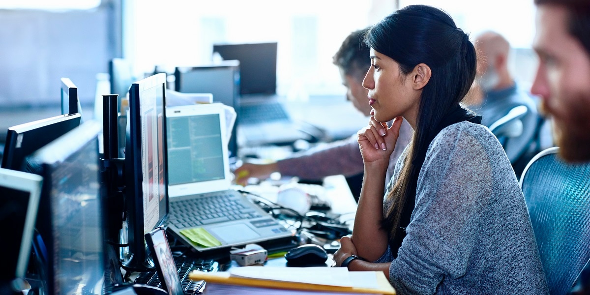 woman looking at computer, office