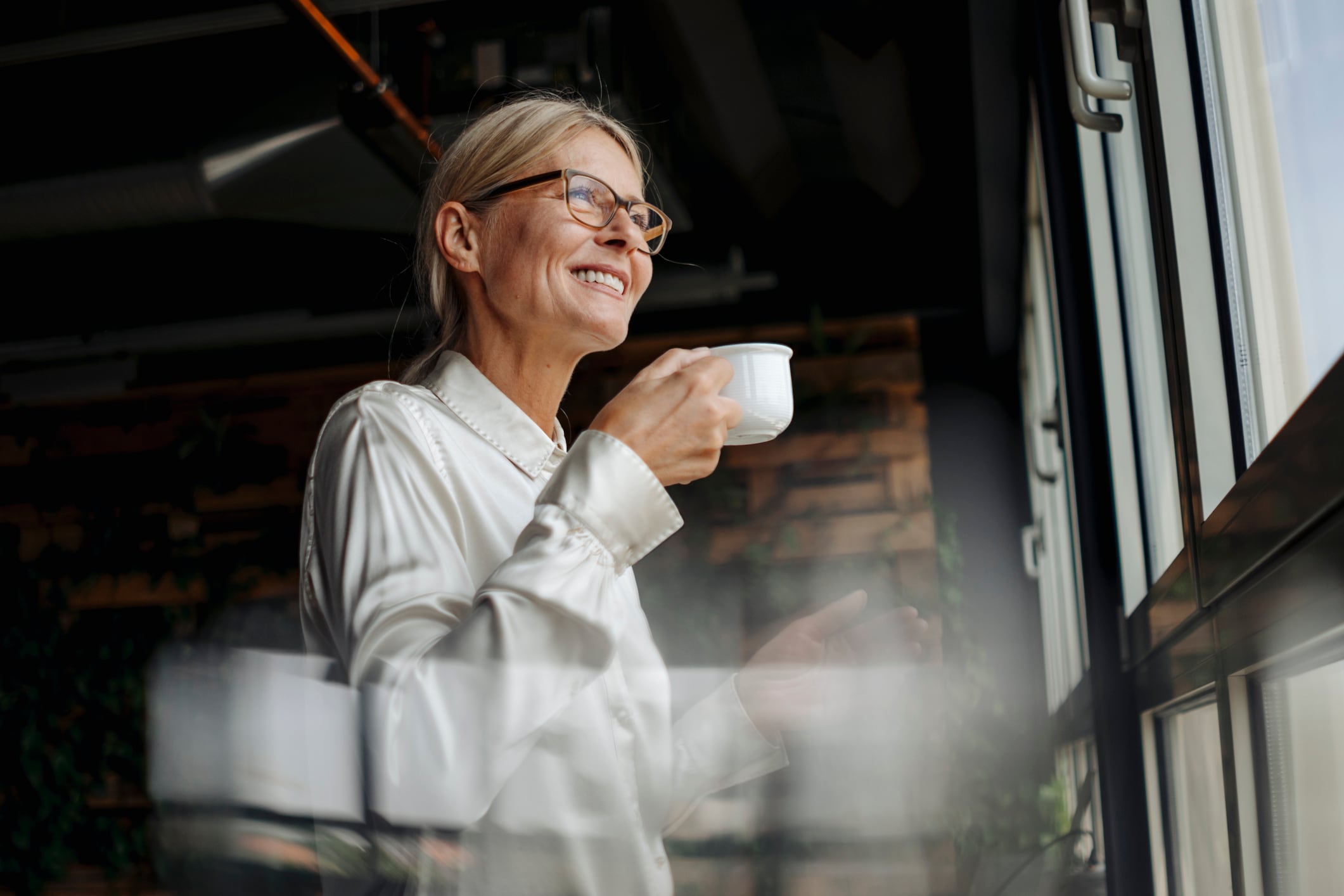 woman smiling, man in the background