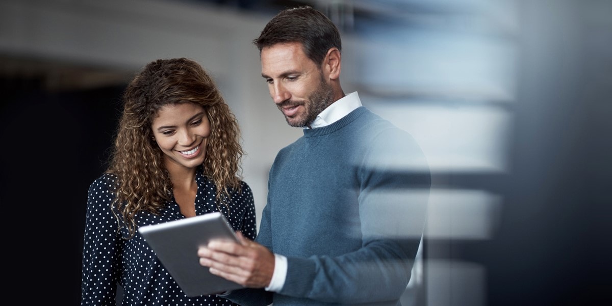 two professionals looking at document